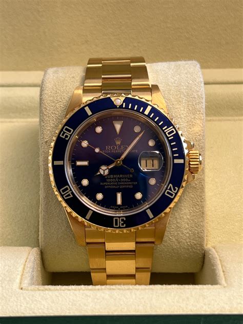 rolex preowned yellow gold sub